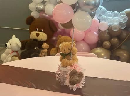 Close detail of a soft, thoughtfully styled celebration centerpiece